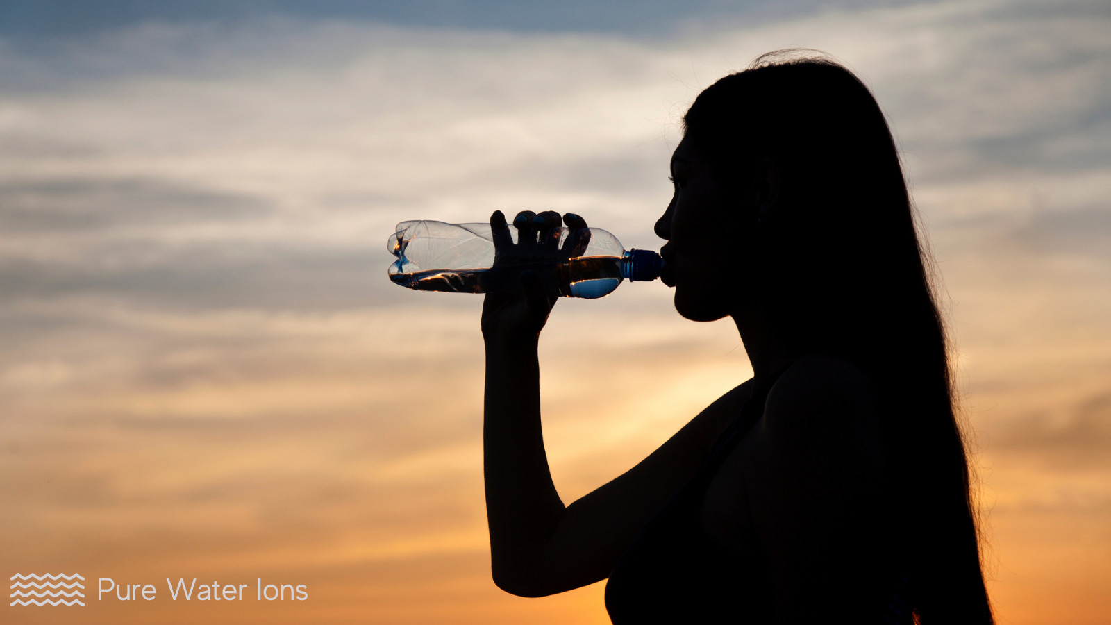 woman drinking diy alkaline water from a bottle