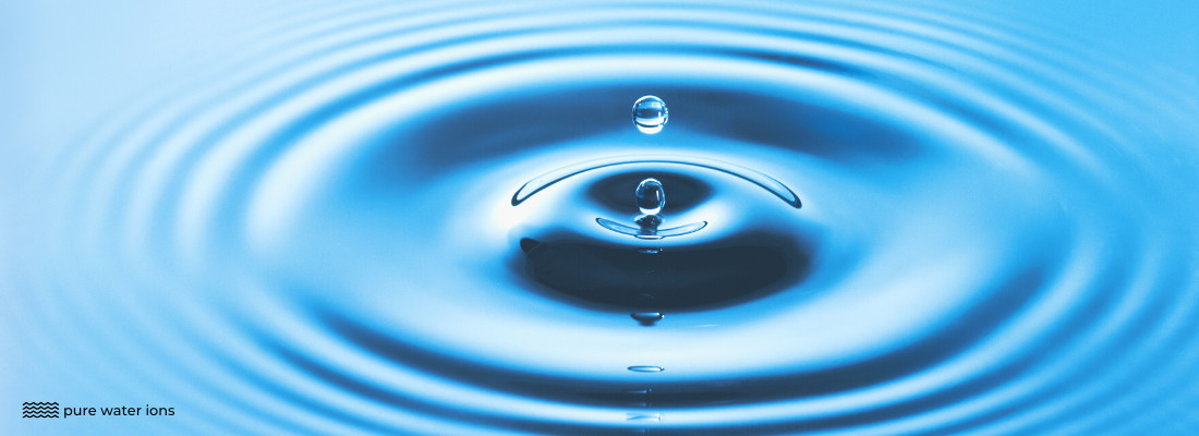 image of a drop of water falling into a pool of water